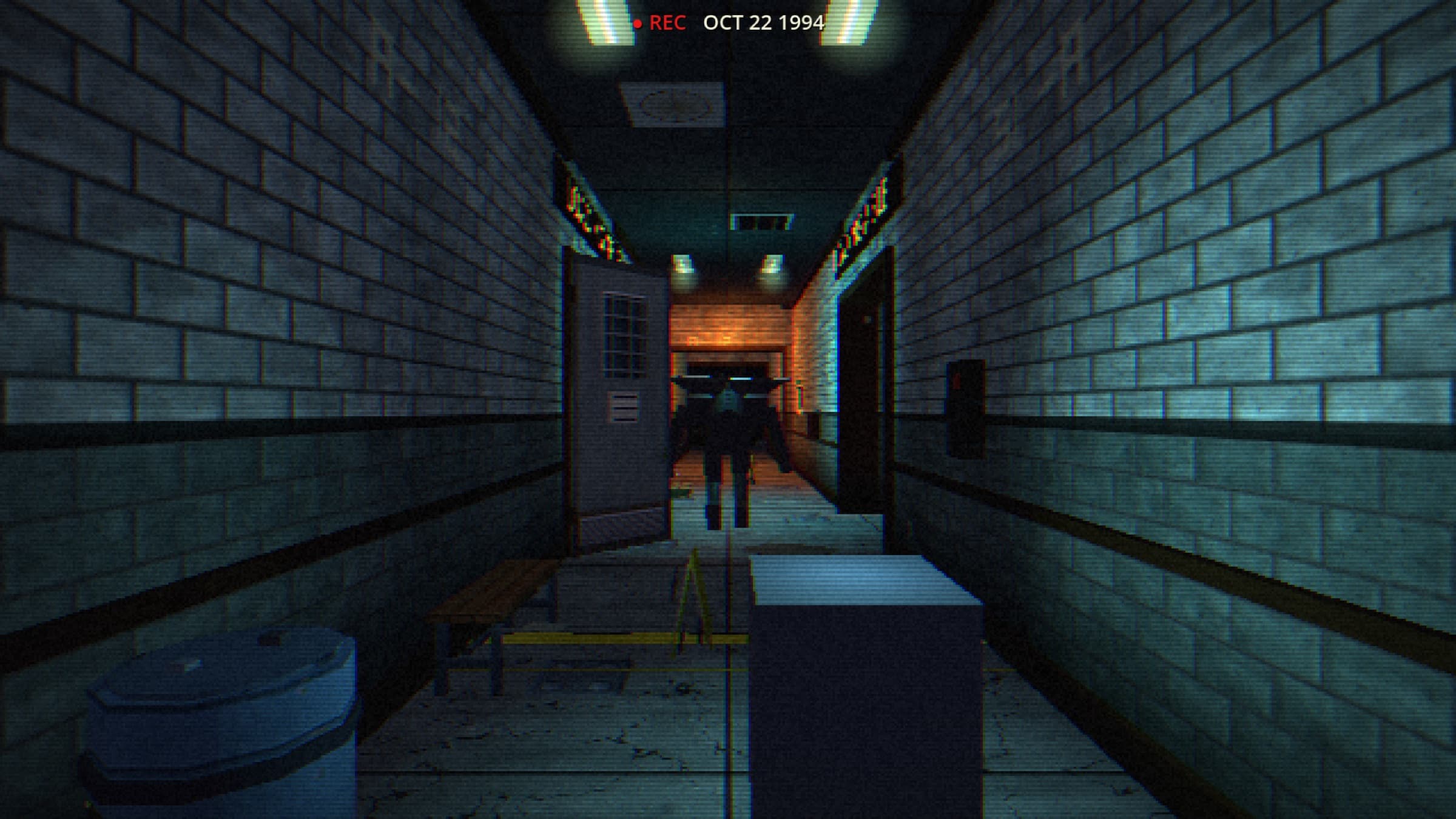 A narrow brick corridor lit in cold blue with a warm glow at the far end.